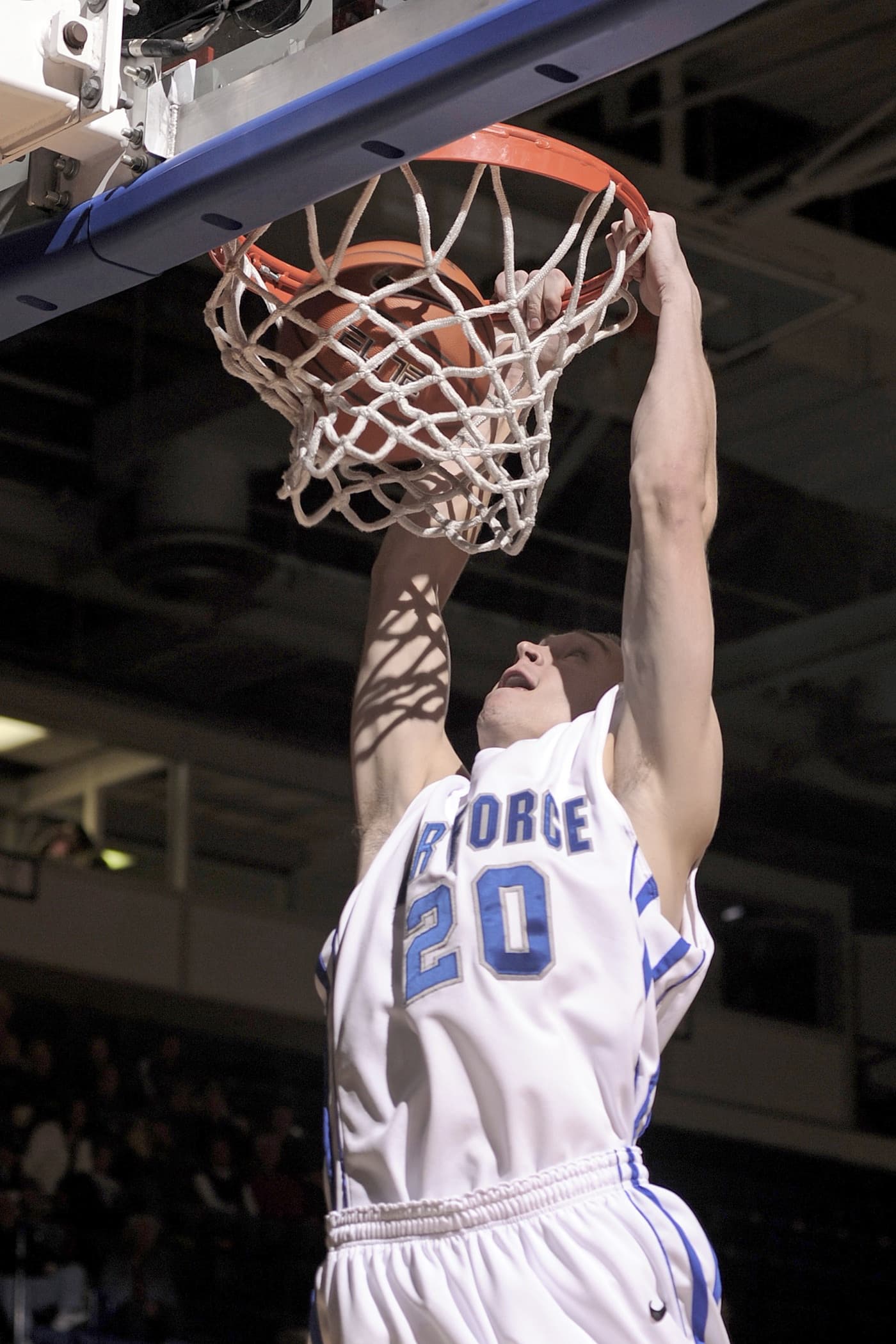 Youth basketball player dunking the ball