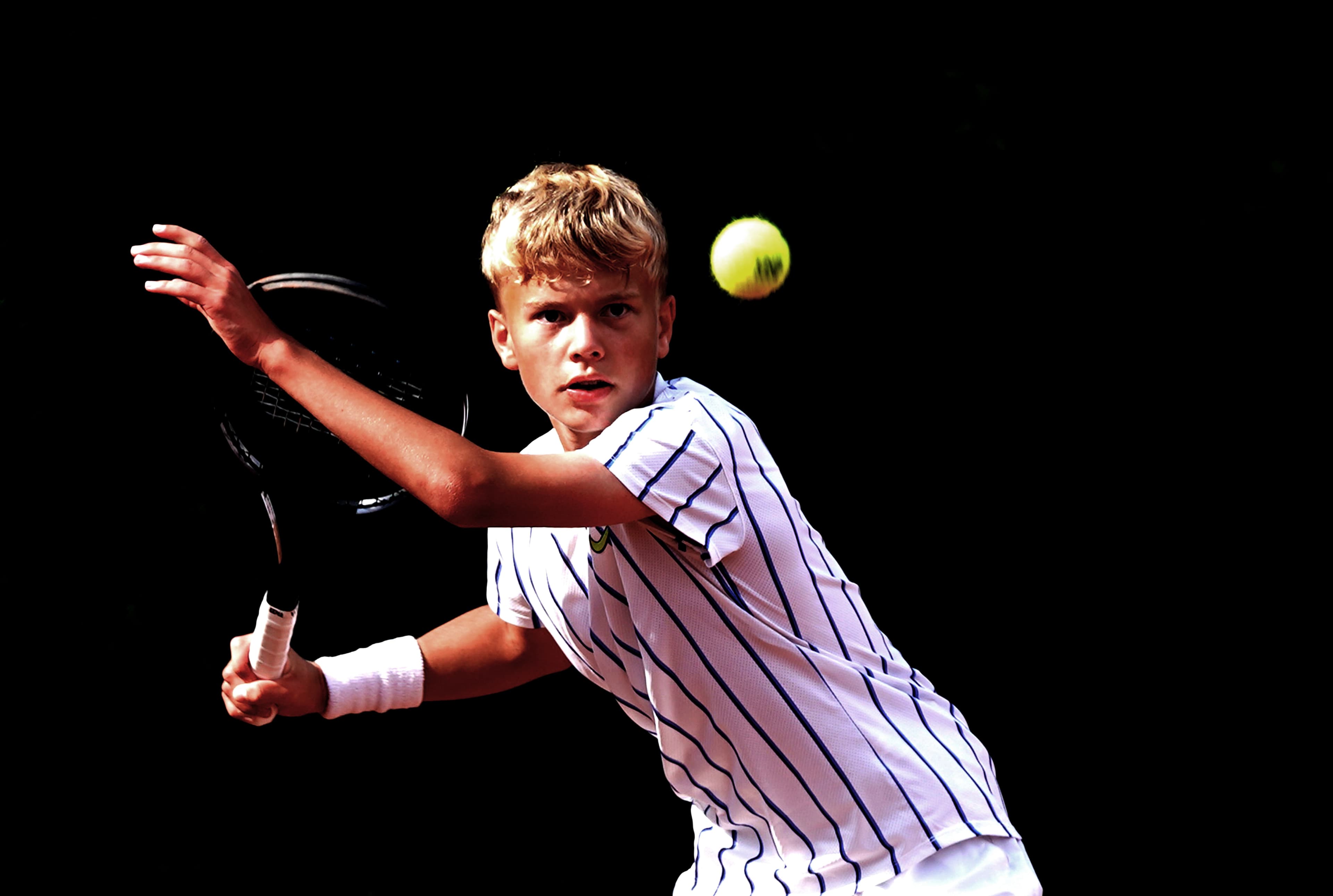 Youth tennis player preparing a shot